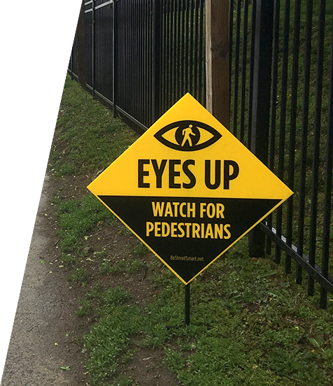 Eyes Up, Watch For Pedestrians Sign